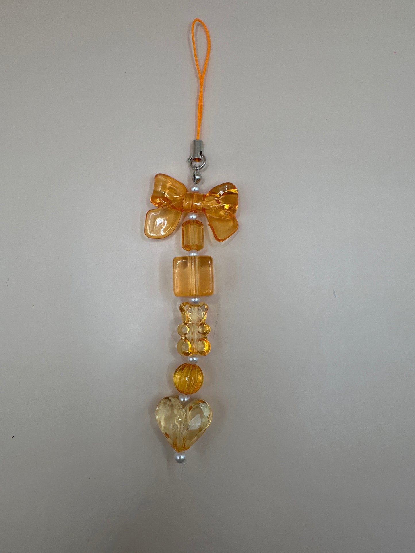 Orange gummy heart phonecharm